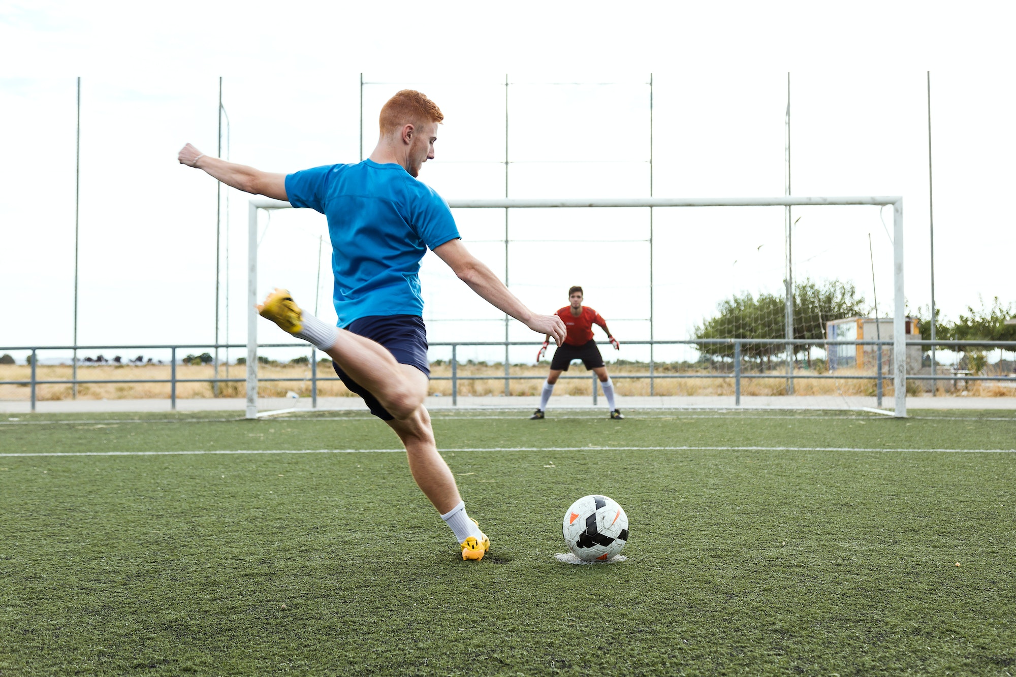 Player kicking a soccer ball